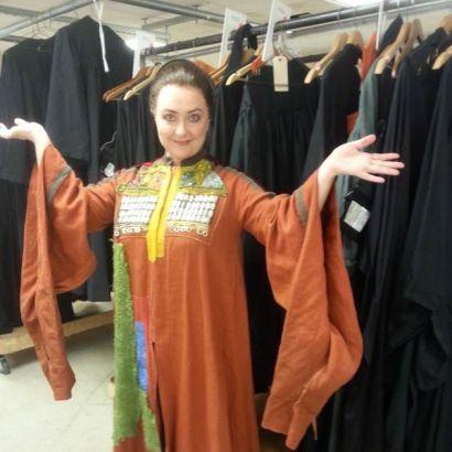 Peterson wearing an ornamental gown costume