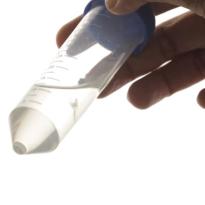 a hand holds a pointed graduated cylinder.